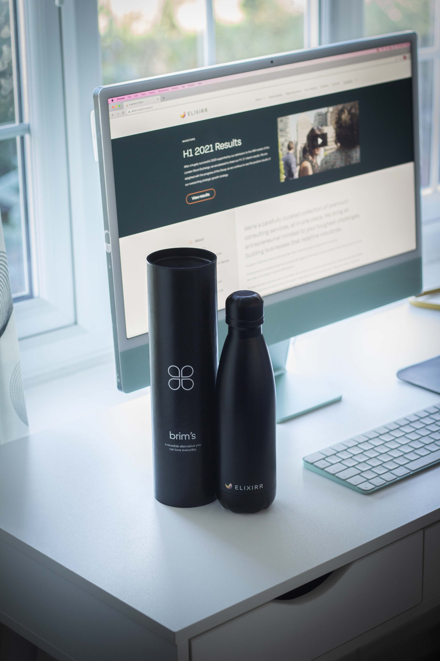 Black corporate branded bottle for Elixxir Consulting